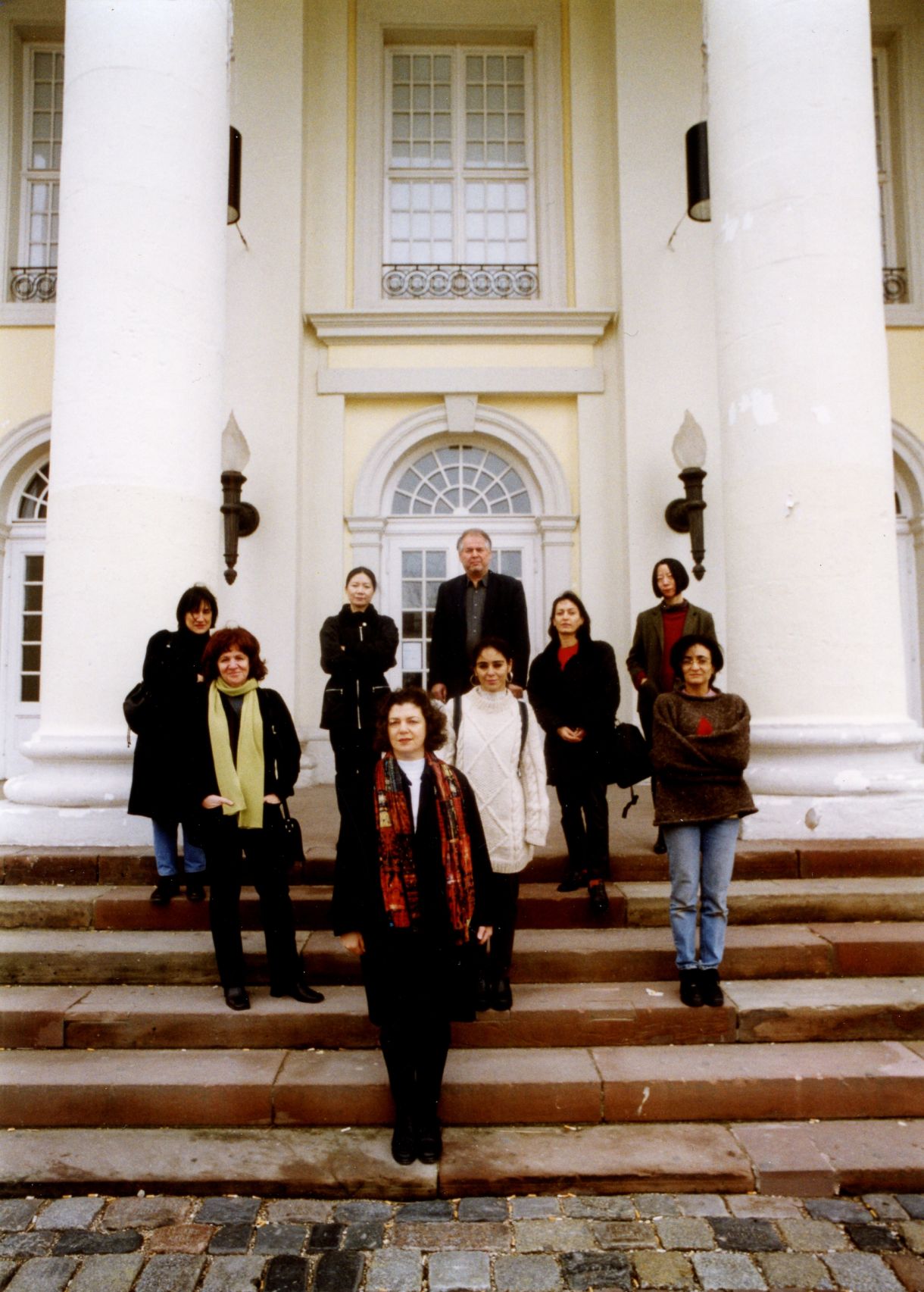 René Block stands with a group of female artists on the steps in front of the Museum Fridericianum.